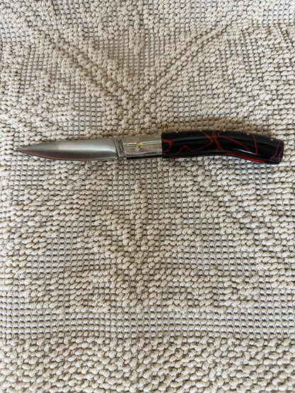 Coltello pattadese con anima ,lama 9 CM ,impugnatura  in kirinite rossa e nera.